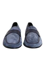 Dolce & Gabbana blue suede loafers with black leather trim and silver-tone logo hardware, front view.