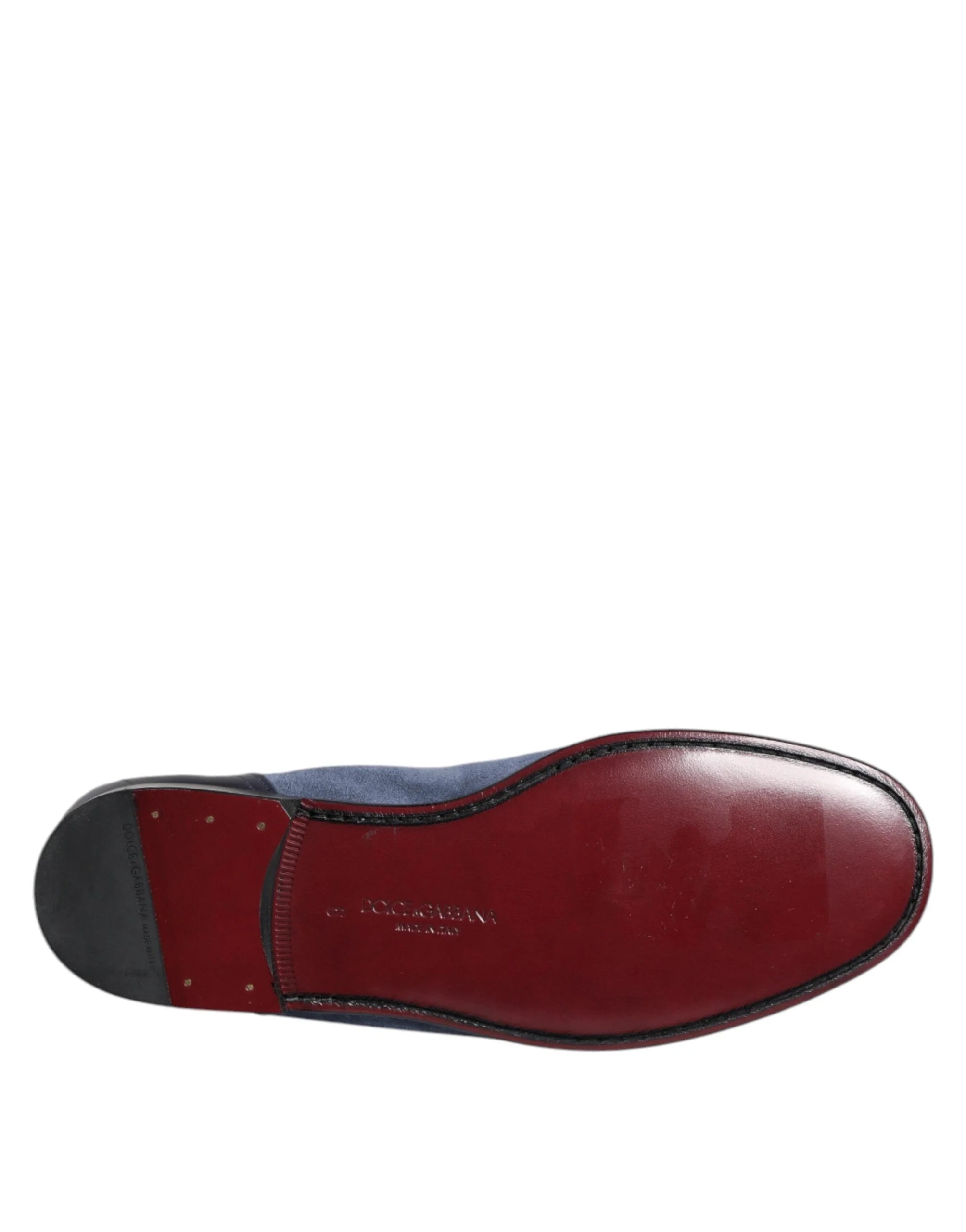 Pair of Dolce & Gabbana blue suede and black leather moccasins presented in a classic editorial style.