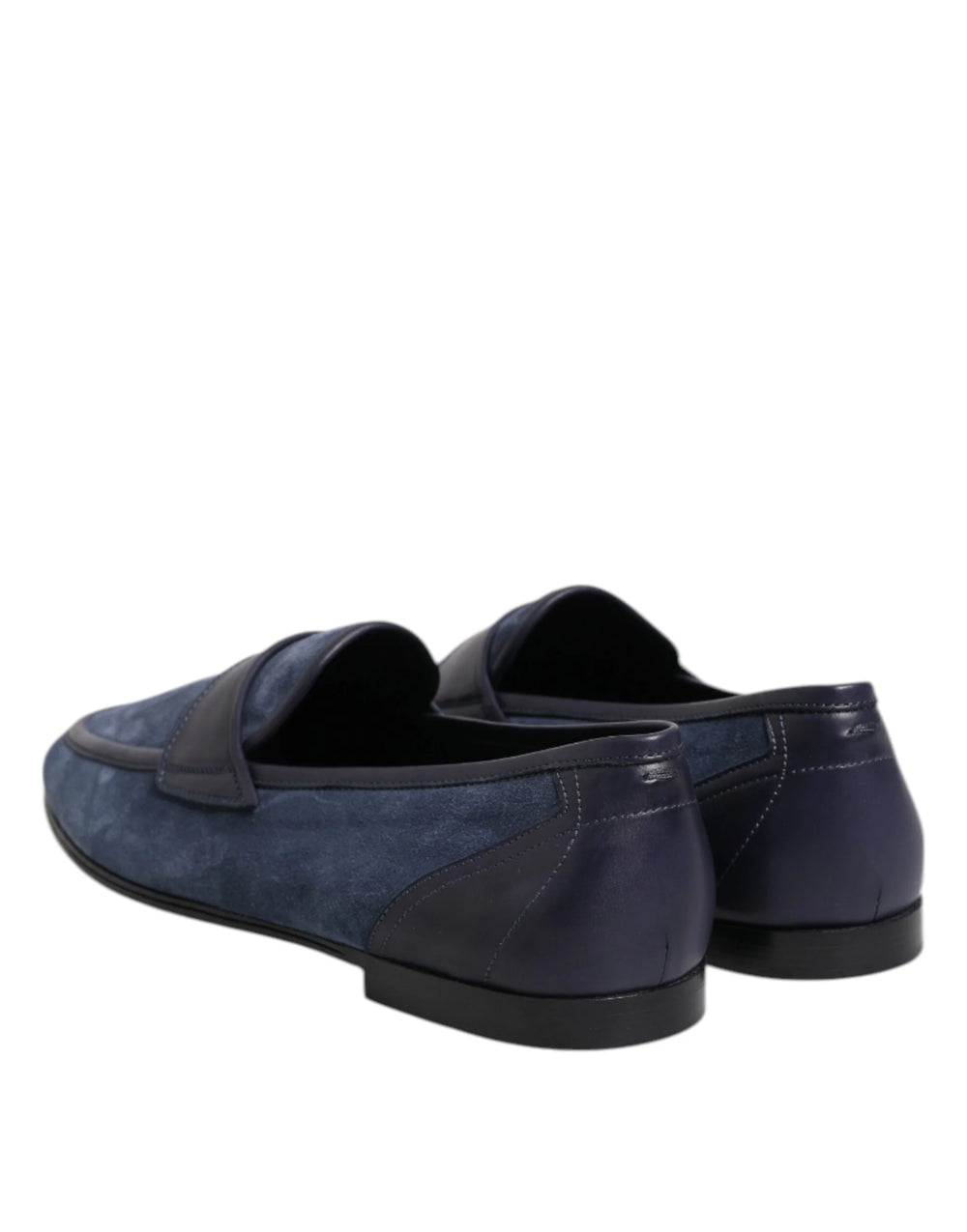 Top-down view of blue suede Dolce & Gabbana loafers highlighting the almond toe and branded leather insoles.