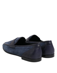 Top-down view of blue suede Dolce & Gabbana loafers highlighting the almond toe and branded leather insoles.