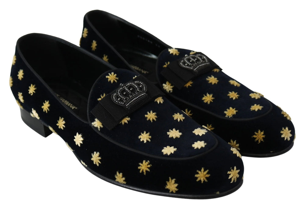 Angled view of the blue velvet crown slippers by Dolce & Gabbana, reflecting the rich texture of the cotton velvet.
