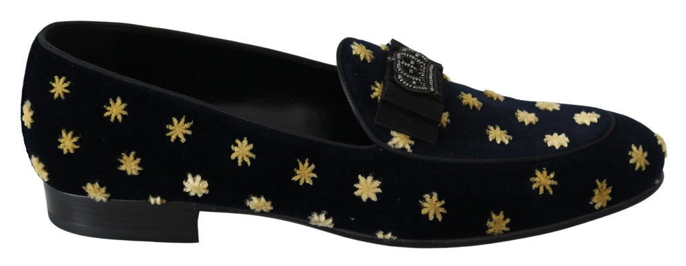 Side profile of Dolce & Gabbana blue velvet loafers showing the elegant silhouette and low stacked heel.