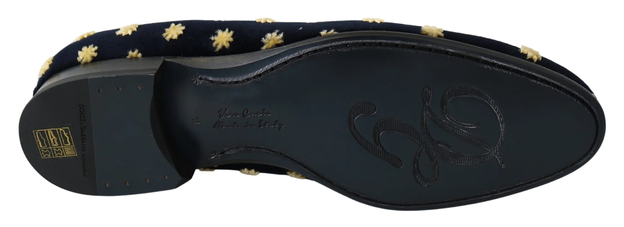 Close-up of the intricate gold thread crown embroidery on the plush blue cotton velvet upper.