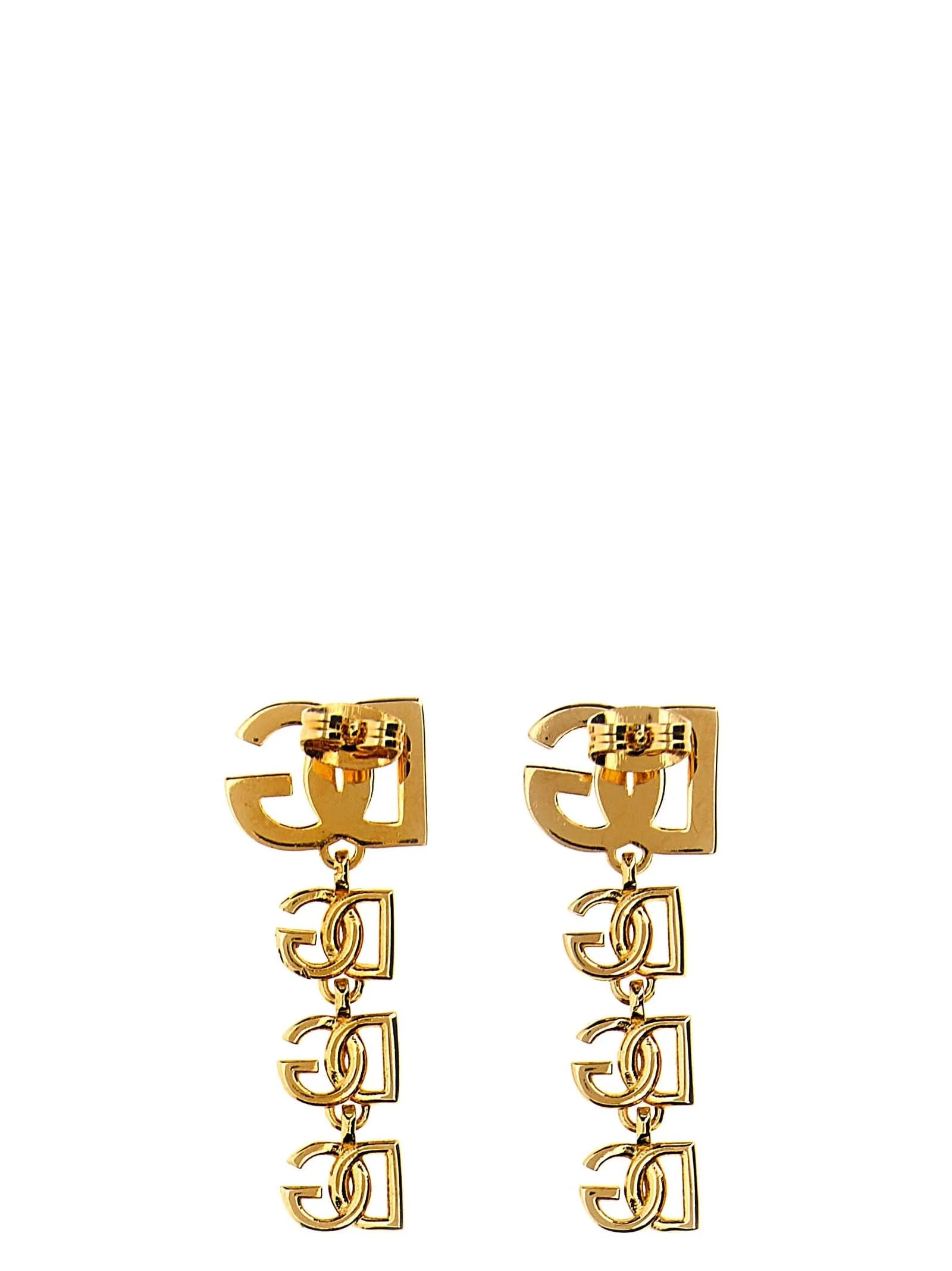 Seitenansicht der Dolce & Gabbana goldfarbenen Ohrringe, die den raffinierten metallischen Glanz und die strukturelle Tiefe zeigen.