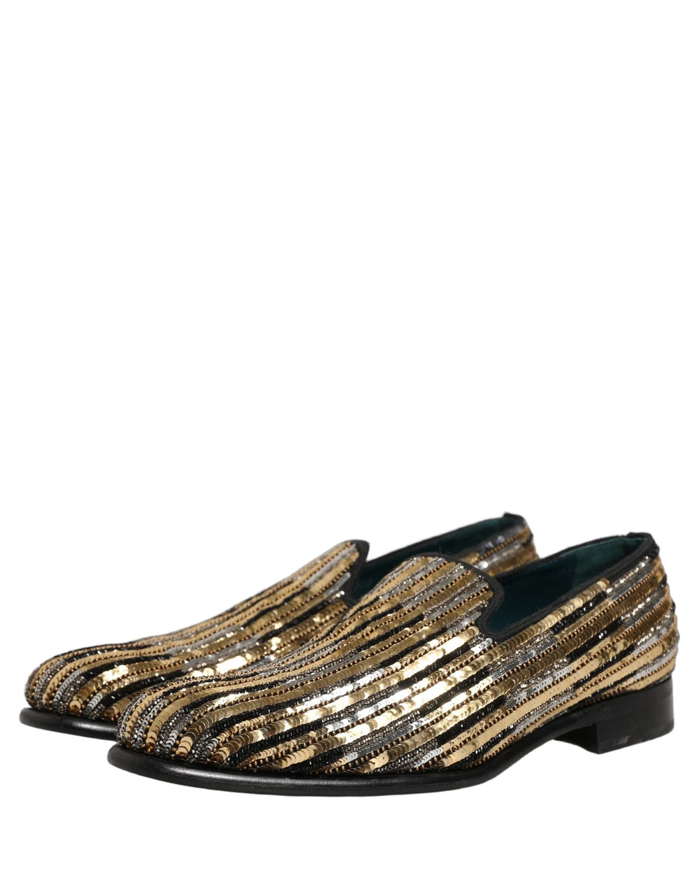 Vue de dessus des mocassins Dolce & Gabbana à rayures dorées avec des semelles en cuir et un branding signature pour un confort raffiné.