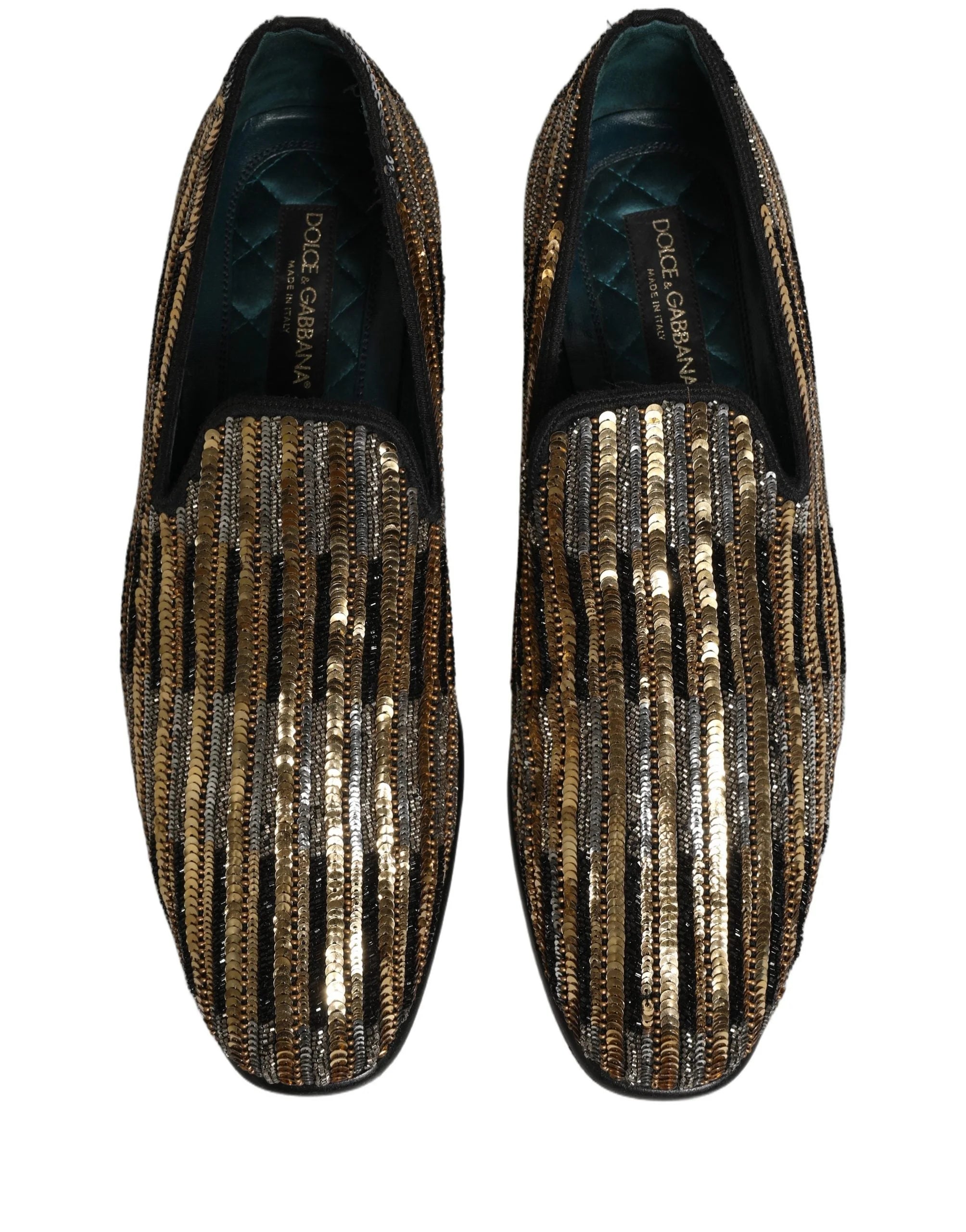 Vue arrière des mocassins dorés Dolce & Gabbana, soulignant le contre-talon structuré et le placement méticuleux des sequins.