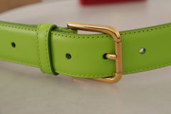 Side profile of the Dolce & Gabbana Devotion belt in green leather with gold-tone hardware and micro pouch.