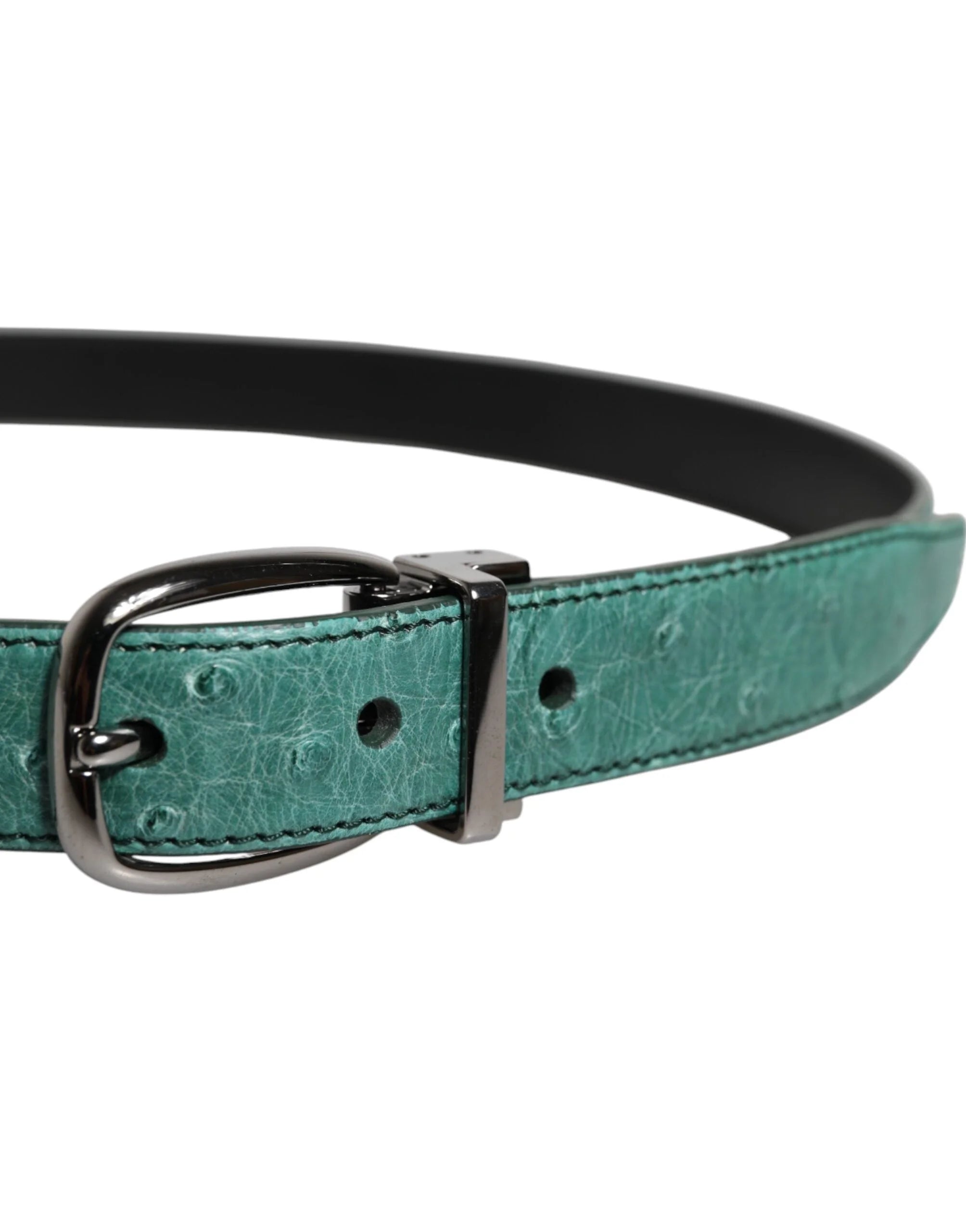 Close-up of the silver metal buckle and the exotic grain of the green ostrich leather on this AmeOro selection.