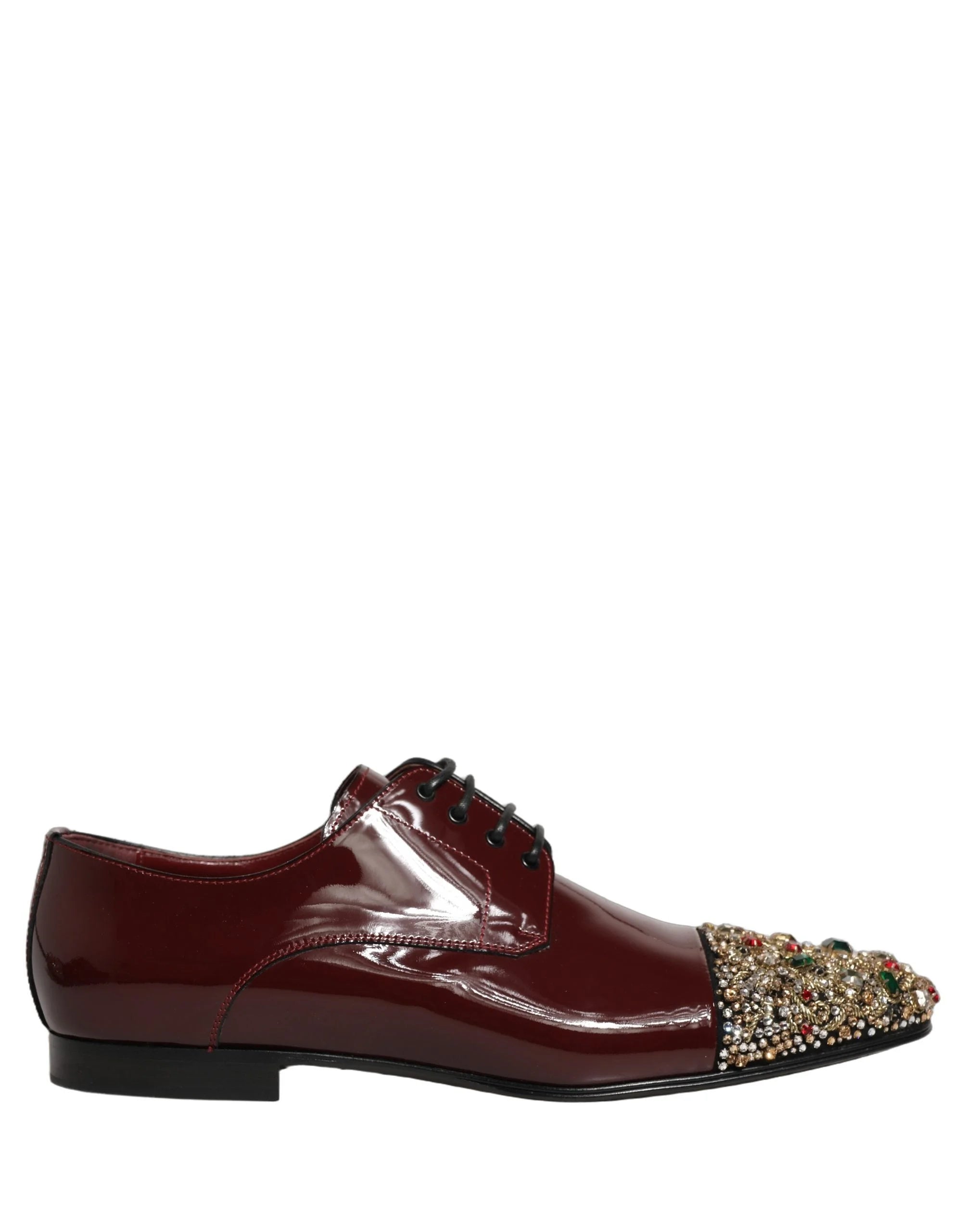 Detailpilt marooni nahkvoodri ja kullavärvi Dolce & Gabbana brändi sisepoolsetest marooni Derby kingast.