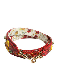 Vista lateral da alça de couro exótico Dolce & Gabbana, selecionada pela AmeOro, com bordados intrincados e motivos florais.