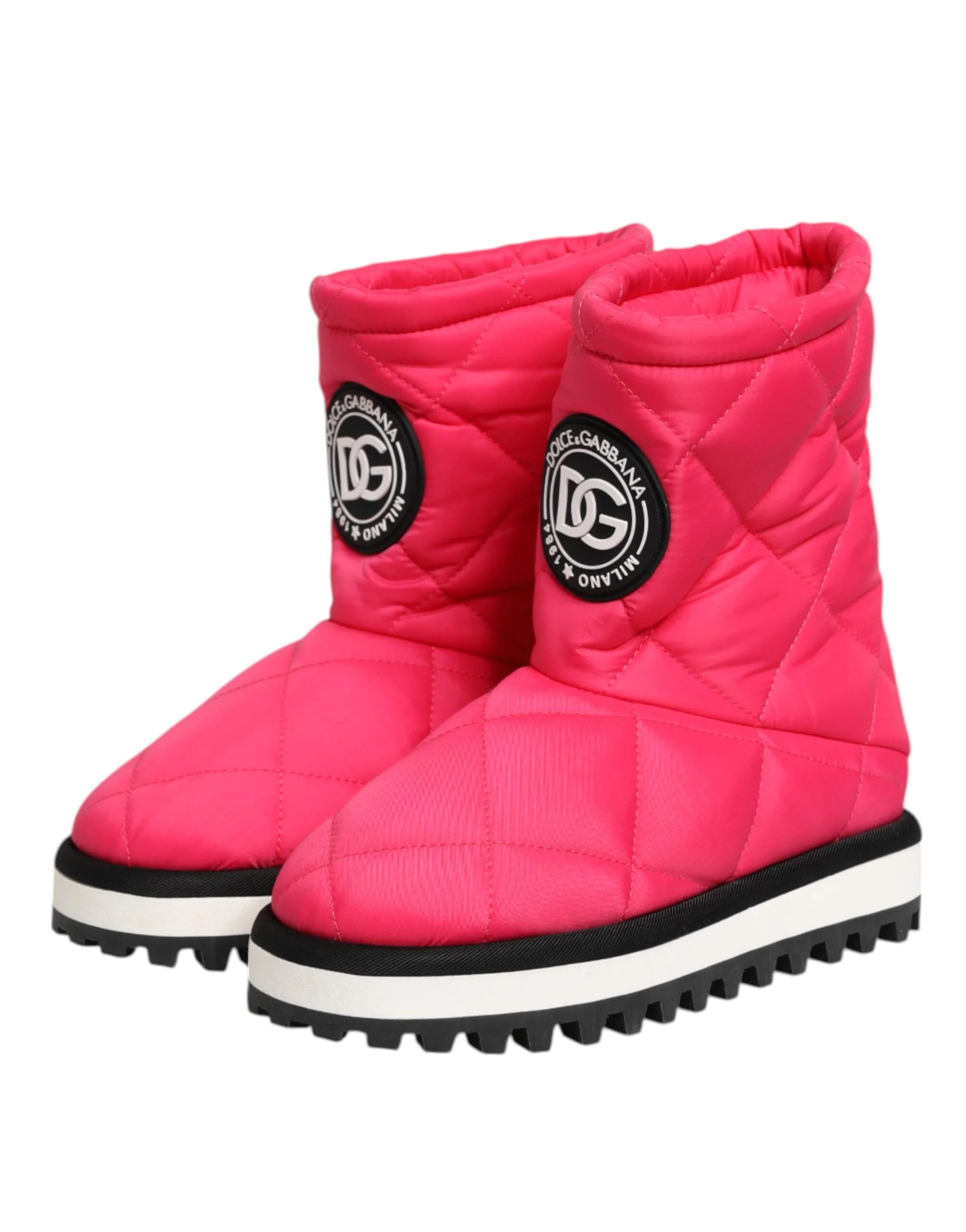 Rear view of the Dolce & Gabbana fuchsia mid-calf boots highlighting the structured heel and padded texture.