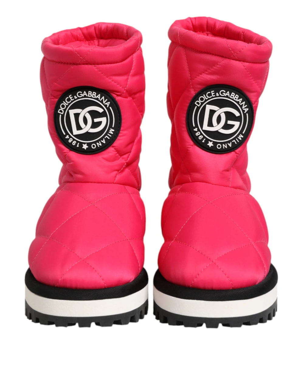 Dolce & Gabbana fuchsia pink and white padded mid-calf boots in a quilted viscose blend with flat soles.