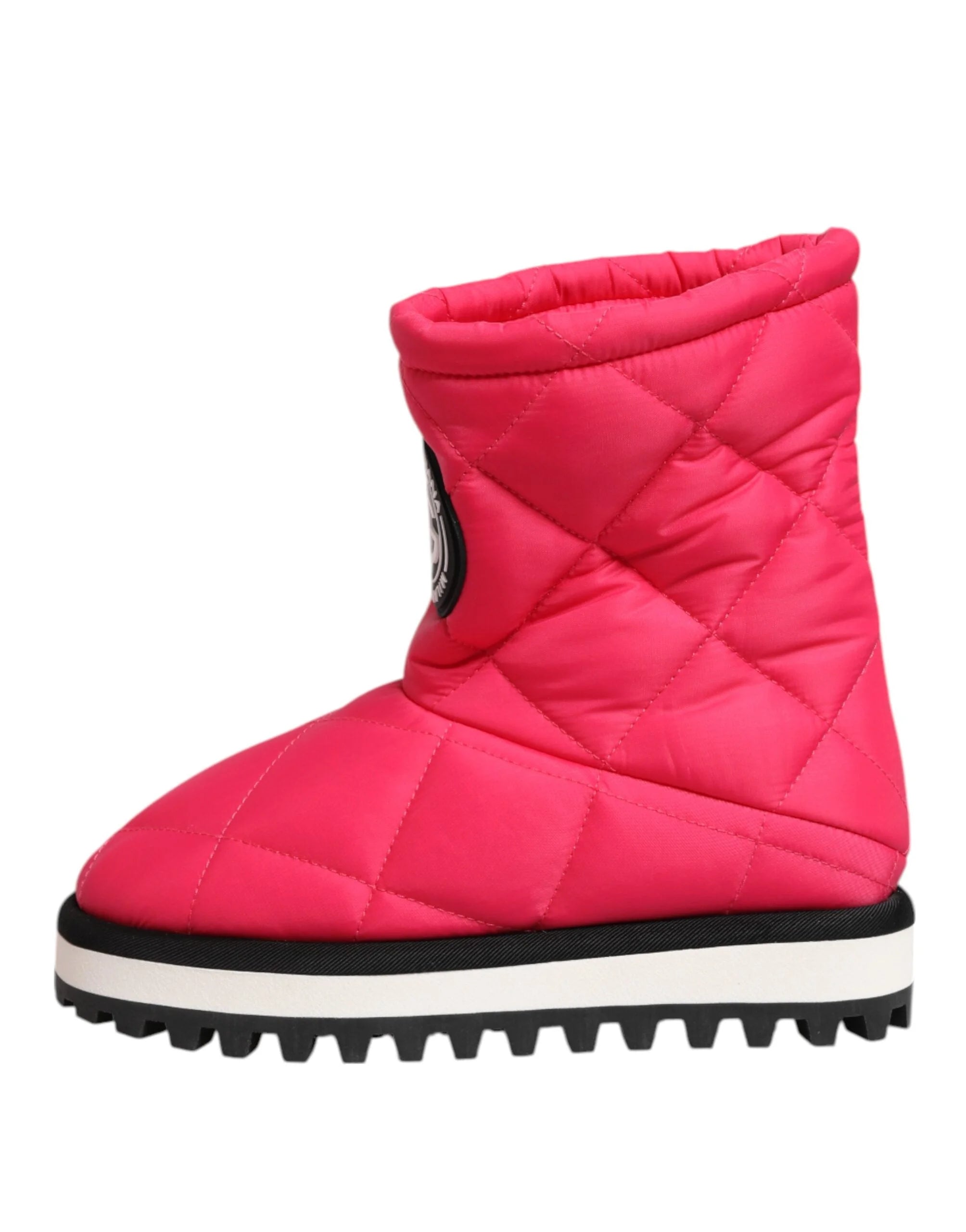 Top-down view of Dolce & Gabbana fuchsia boots showcasing the cushioned interior and wide shaft opening.