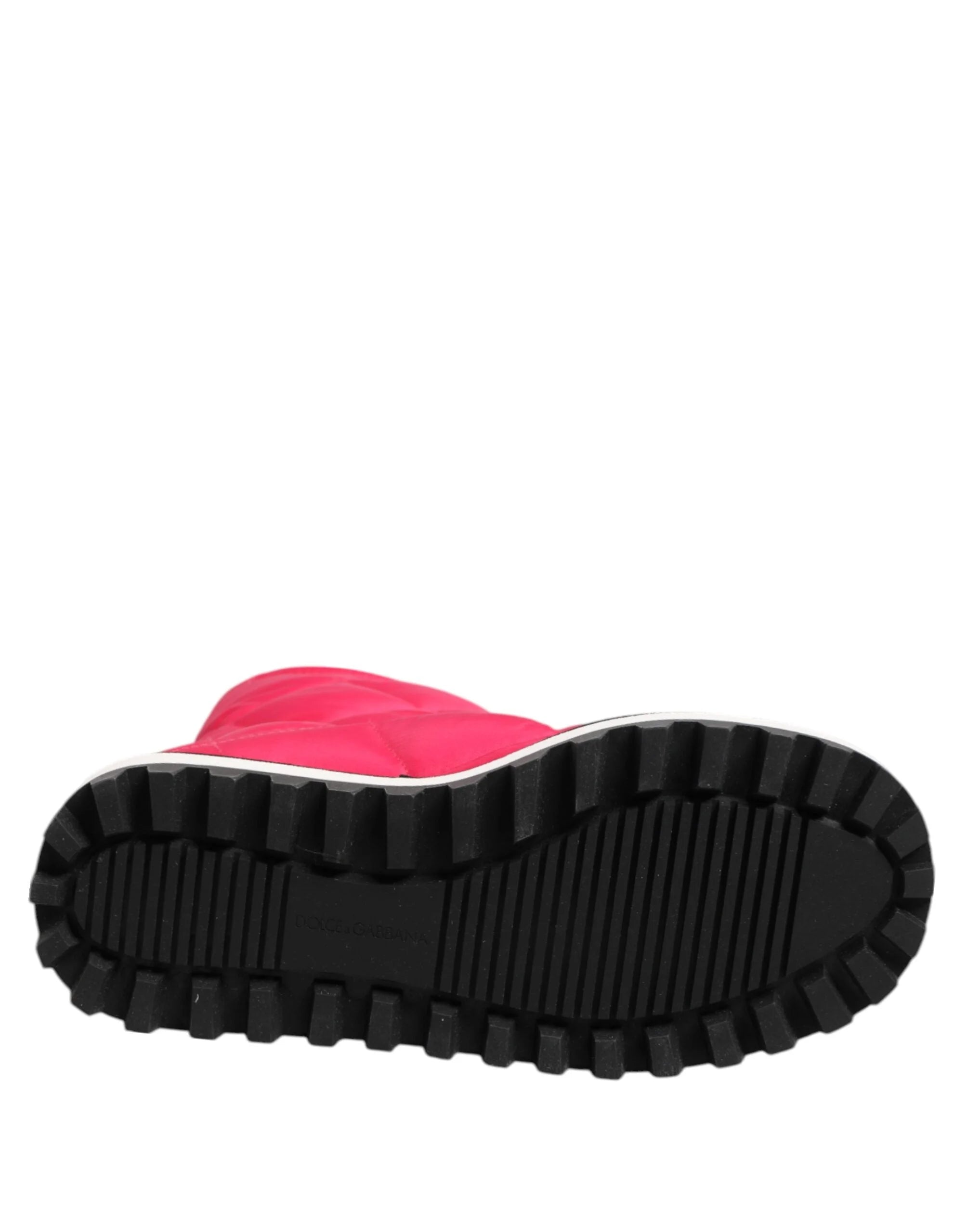 Frontal angle of the Dolce & Gabbana fuchsia and white padded boots emphasizing the bold, rounded toe.