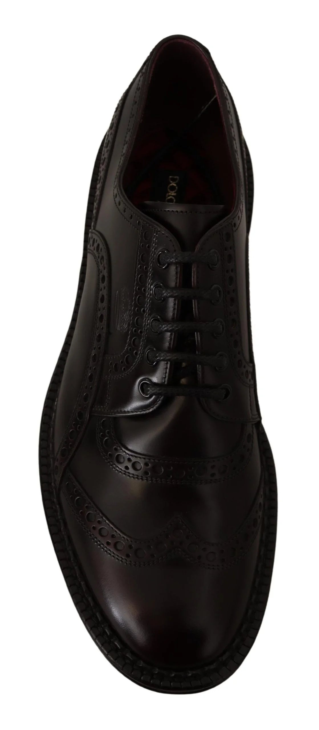 Priveliște de pe talpă a pantofului formal Dolce & Gabbana, care dezvăluie talpa din piele de înaltă calitate și logo-ul brandului gravat.