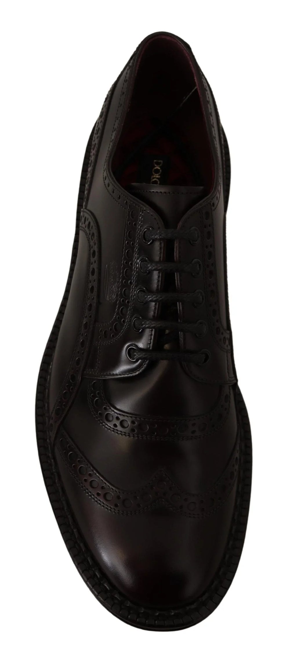 Priveliște de pe talpă a pantofului formal Dolce & Gabbana, care dezvăluie talpa din piele de înaltă calitate și logo-ul brandului gravat.