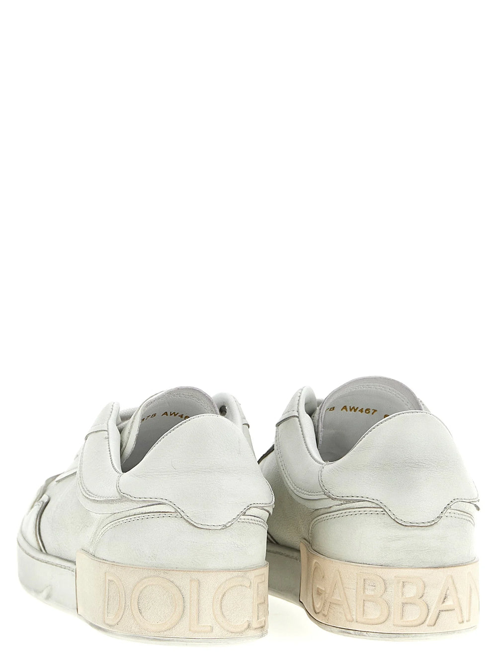 Sideprofil av Dolce & Gabbana hvite lær sneakers som viser den raffinerte sømmen og slitesterke gummisålen.