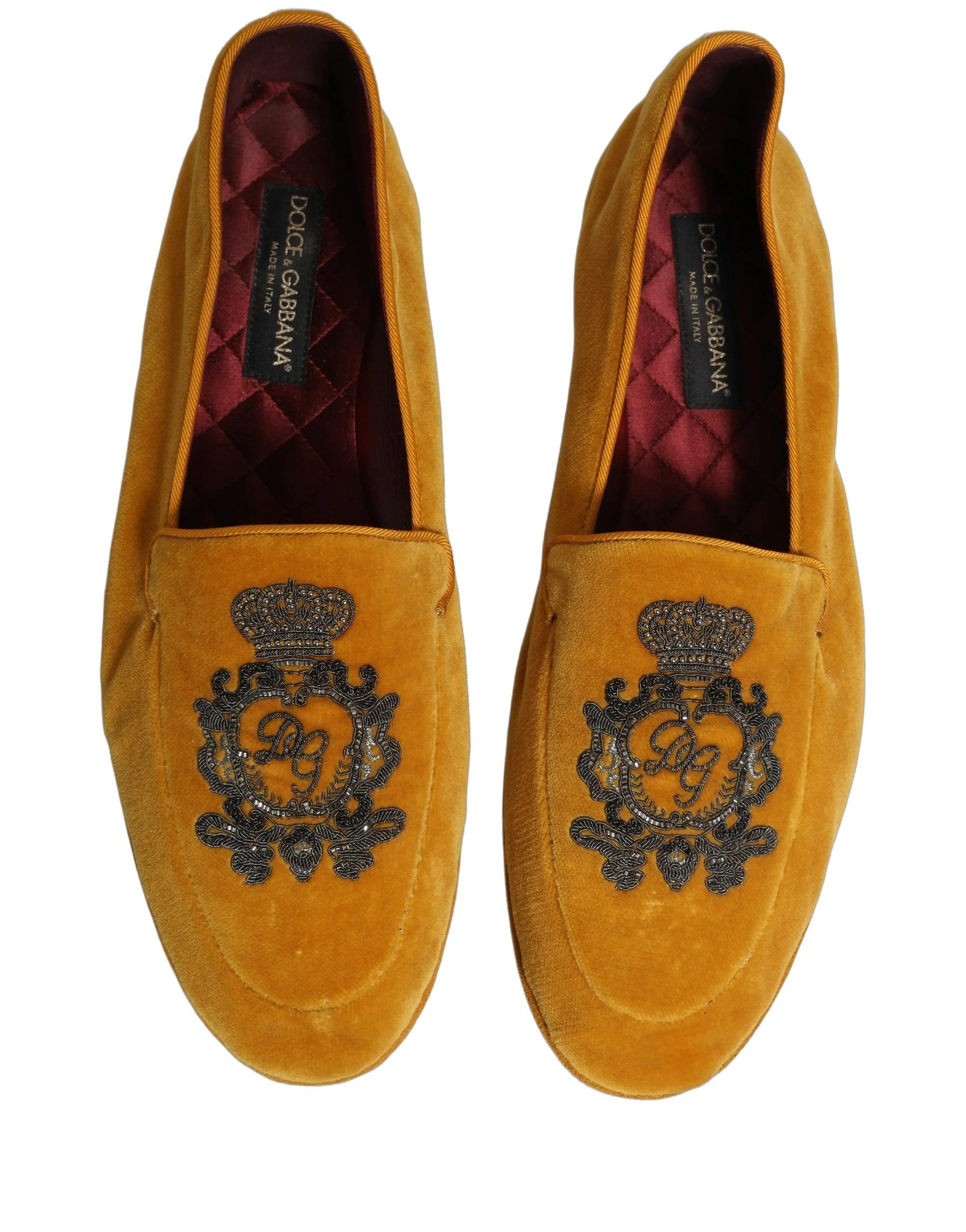 Rear view of the Dolce & Gabbana velvet loafers highlighting the structured heel and refined yellow textile finish.
