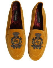 Rear view of the Dolce & Gabbana velvet loafers highlighting the structured heel and refined yellow textile finish.