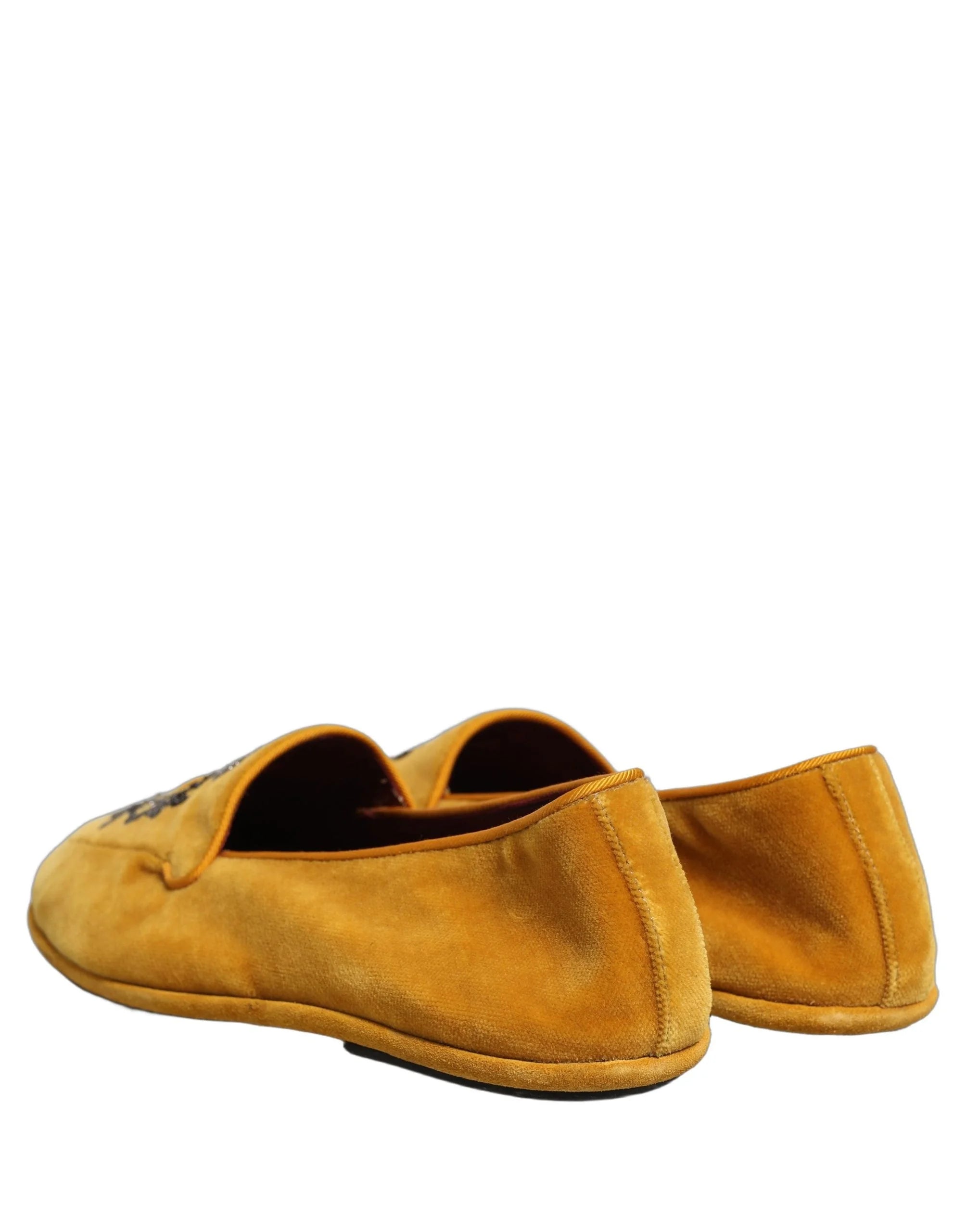 Top-down view of Dolce & Gabbana loafers showcasing the quilted silk lining and branded leather insole.