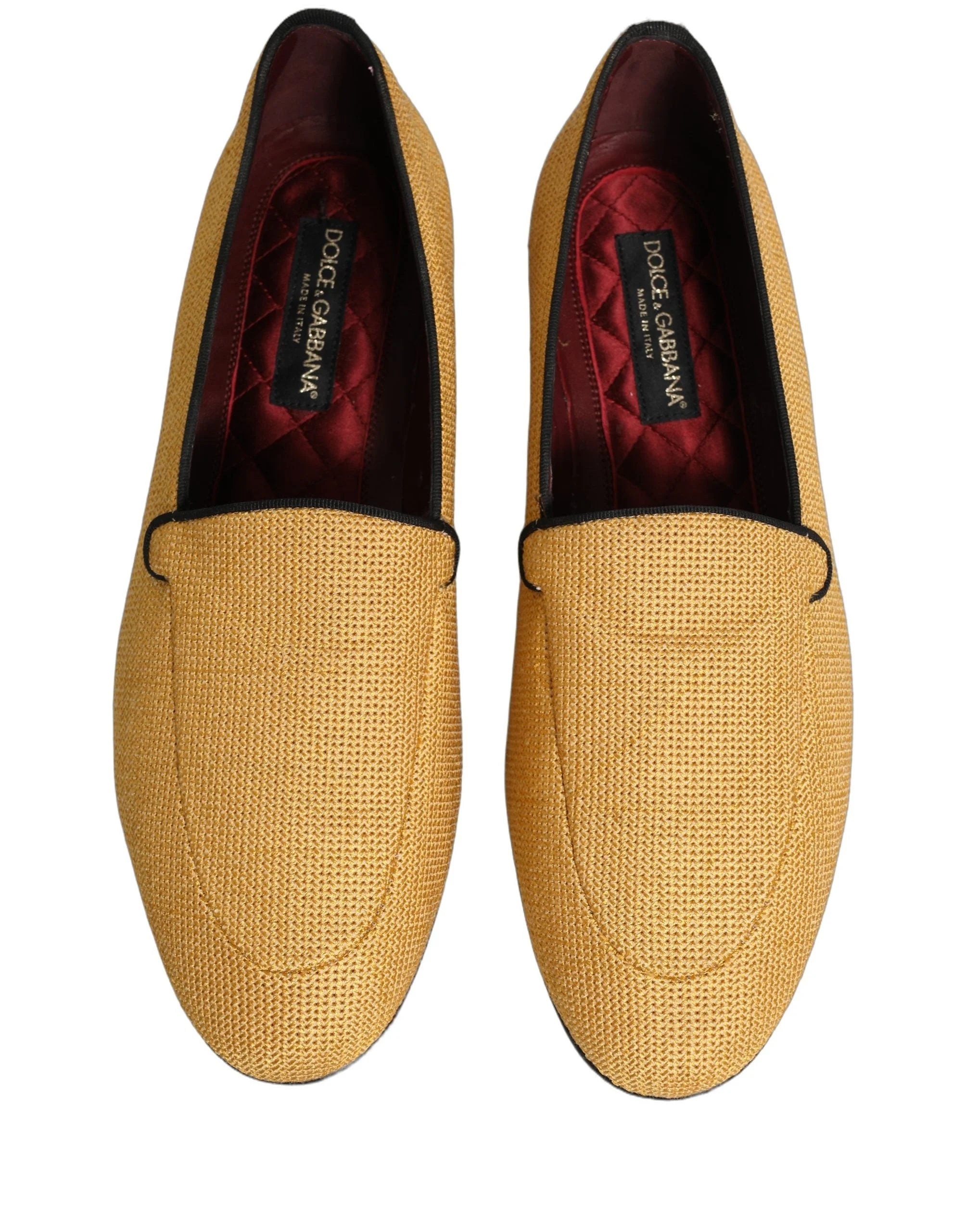 Zadná strana žltých tkanej kožené papúč od Dolce & Gabbana, s tvarovanou oporou päty a čistými líniami.