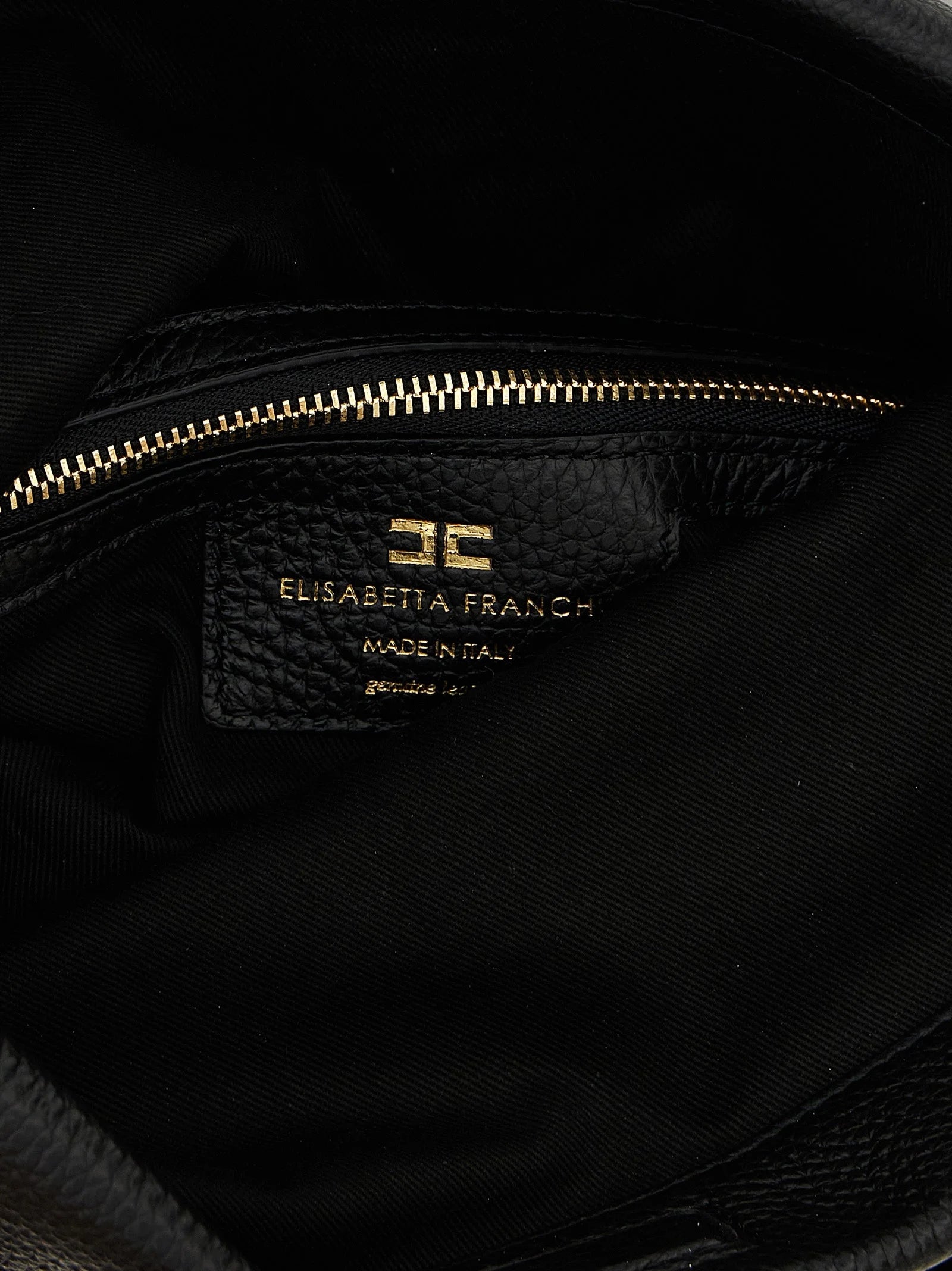 Close-up of the Elisabetta Franchi logo hardware and fine grain texture on the premium black calfskin leather.