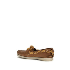 Vista posterior dos sapatos slip-on Golden Goose Bos Taurus, exibindo o calcanhar estruturado e o acabamento em couro premium.