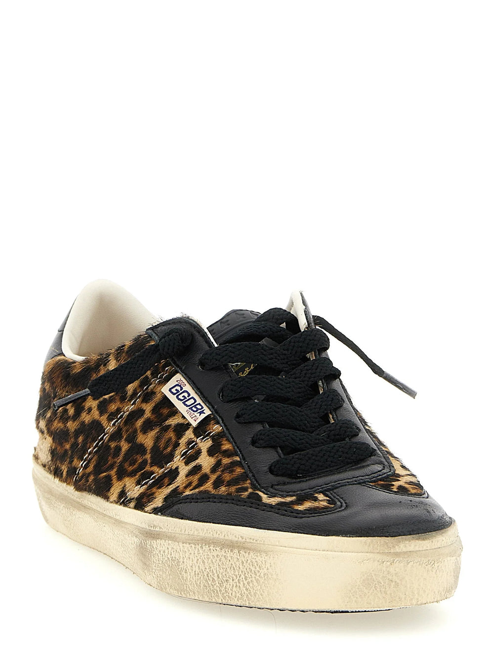 Side profile of Golden Goose leather sneakers showing the artisanal weathered sole and vibrant multicolor paneling.