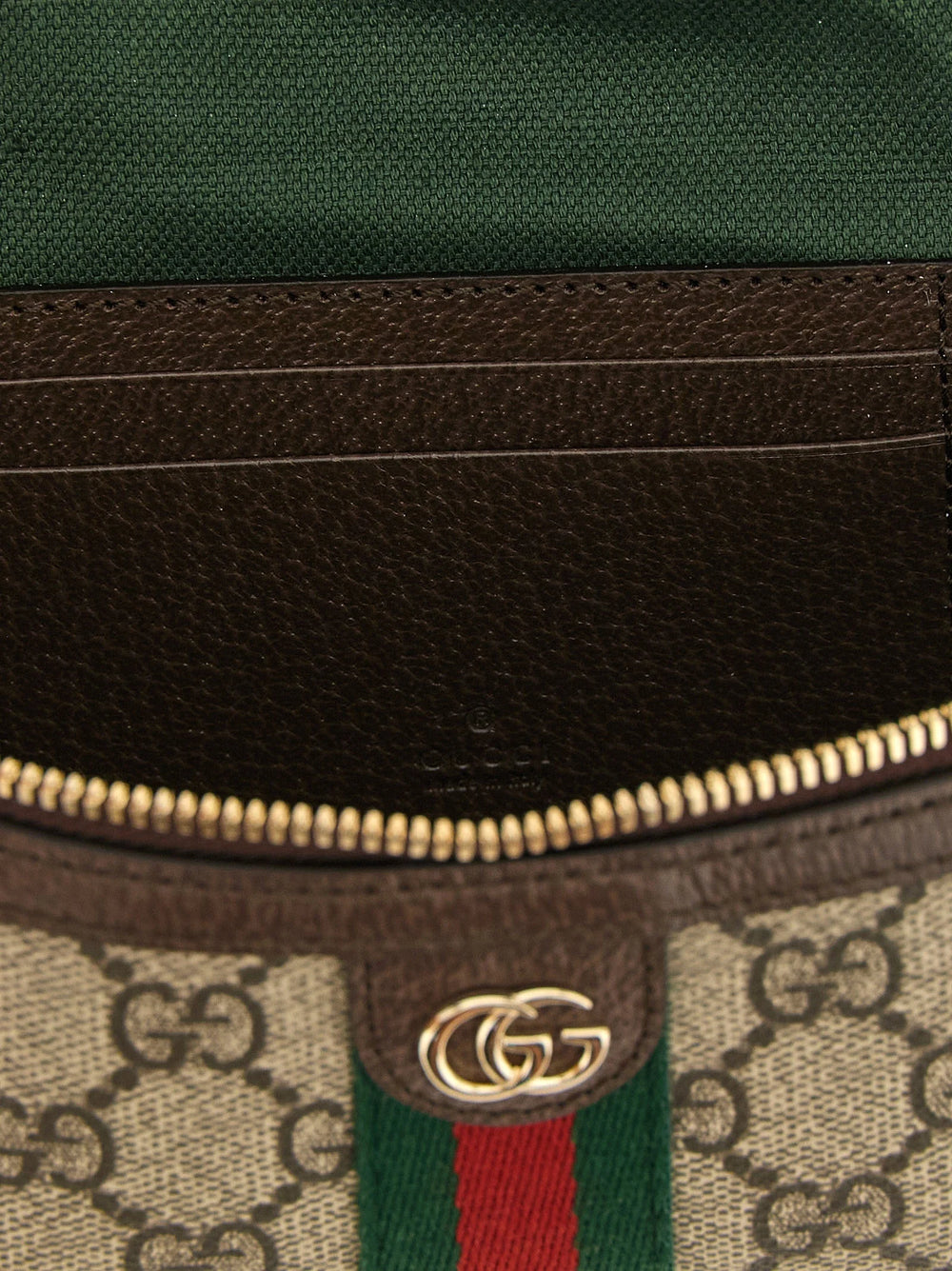 Close-up detail of the Gucci shoulder bag's beige polyethylene material, showcasing the smooth texture and craftsmanship.