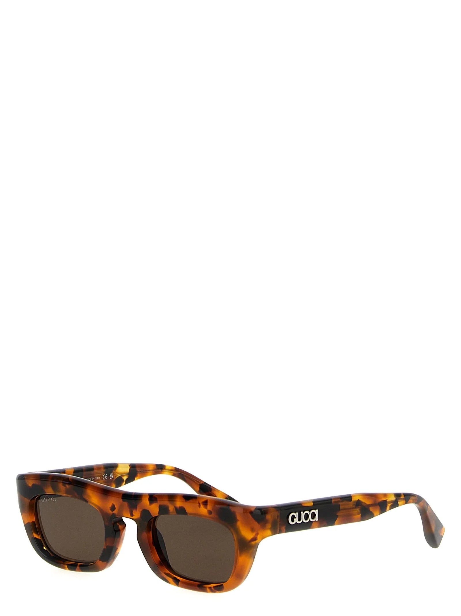 Blick von der Seite der Gucci Luxus-Eyewear in Braunem Acetat, das den polierten Finish und die zeitlose Silhouette hervorhebt.