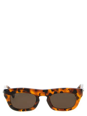 Frontansicht der Gucci Herrensonnenbrille mit klassischem braunem Acetatrahmen und dunkel getönten Gläsern.