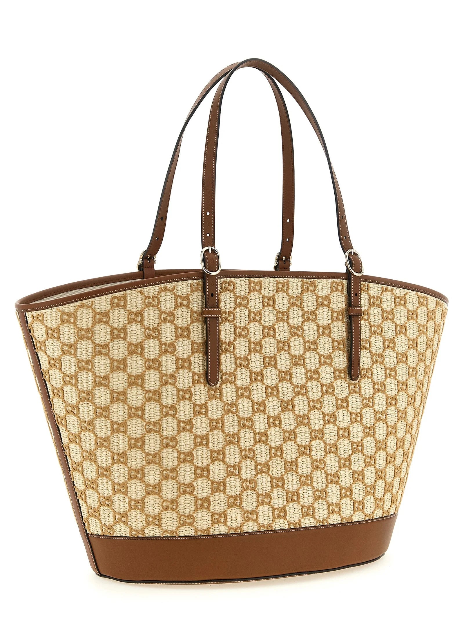 Side profile of the Gucci brown cotton handbag showing the slim silhouette and refined tonal stitching.
