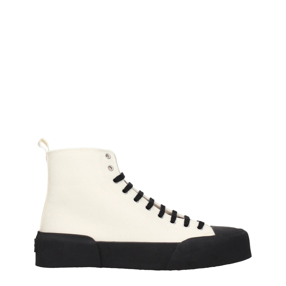 Baskets montantes en tissu beige Jil Sander dotées d'une empeigne minimaliste en toile et d'une semelle en caoutchouc nervurée surdimensionnée.