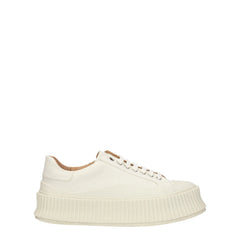 Jil Sanders vita tygplattformssneakers med en minimalistisk siluett och tjocka räfflade gummisulor.