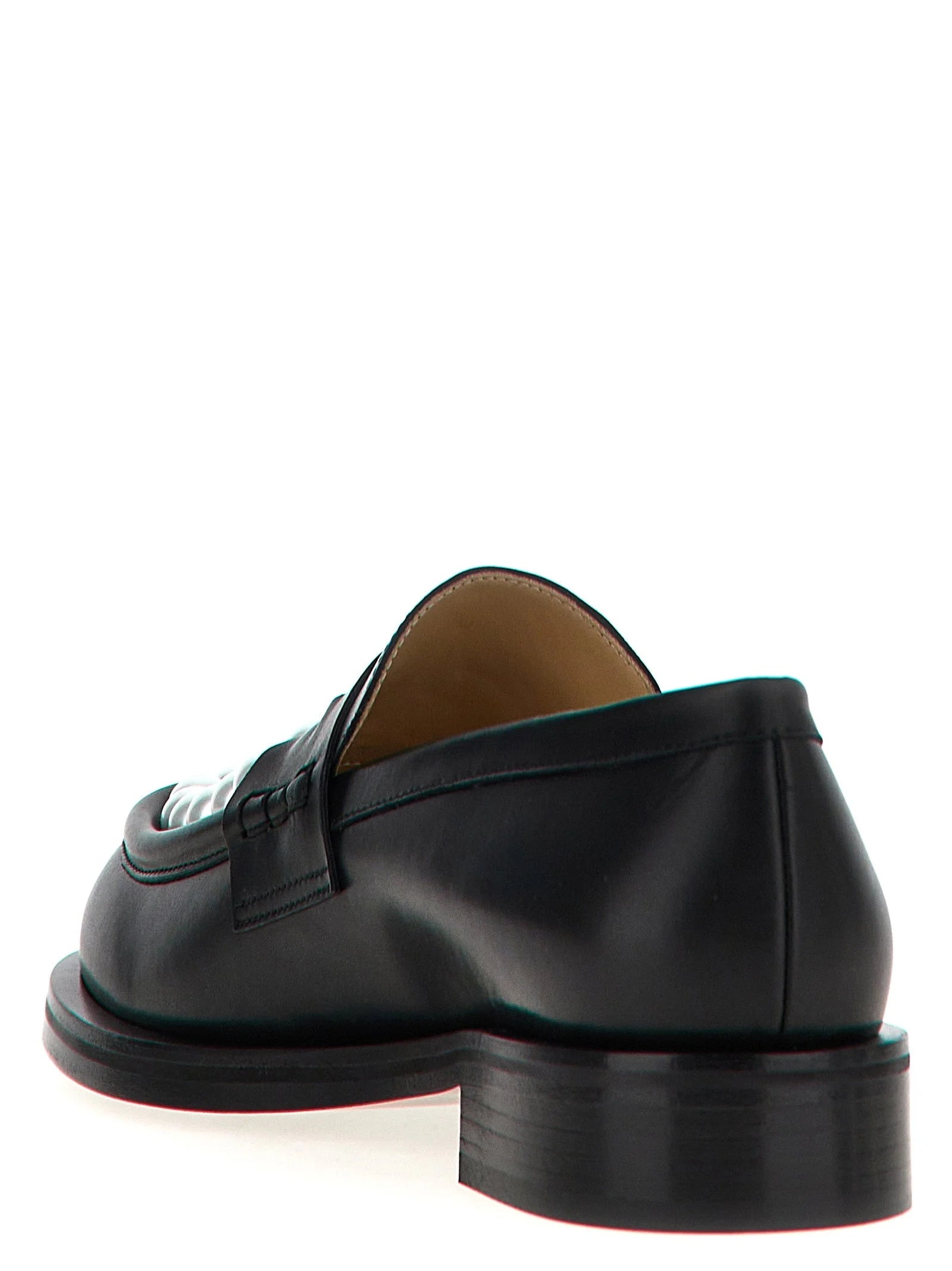 Rear view of the MACH & MACH slip-on loafers highlighting the precise stitching and structured heel construction.