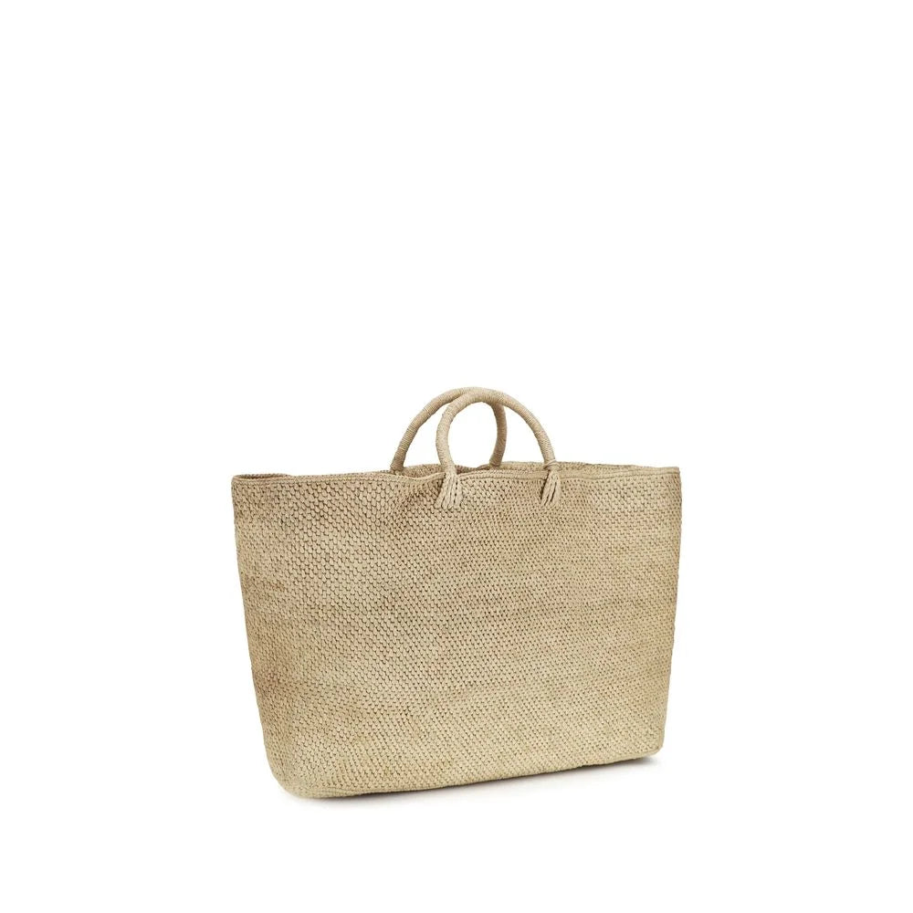 Rear view of the Manebi beige woven handbag, highlighting the consistent craftsmanship and organic textile finish.