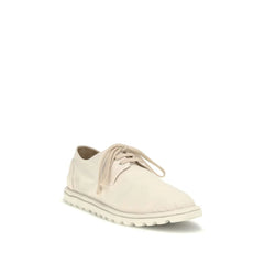 Side profile of Marsell white leather oxfords showing the artisanal tonal stitching and low stacked heel.