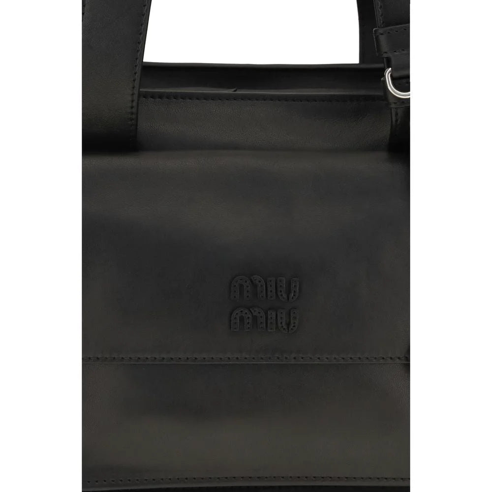 Close-up detail of the Miu Miu Bos Taurus bag, focusing on the premium calf leather texture and tonal stitching.