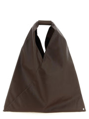 Sac cabas japonais marron en polyéthylène MM6 Maison Margiela, présentant une silhouette triangulaire et une anse supérieure intégrée.