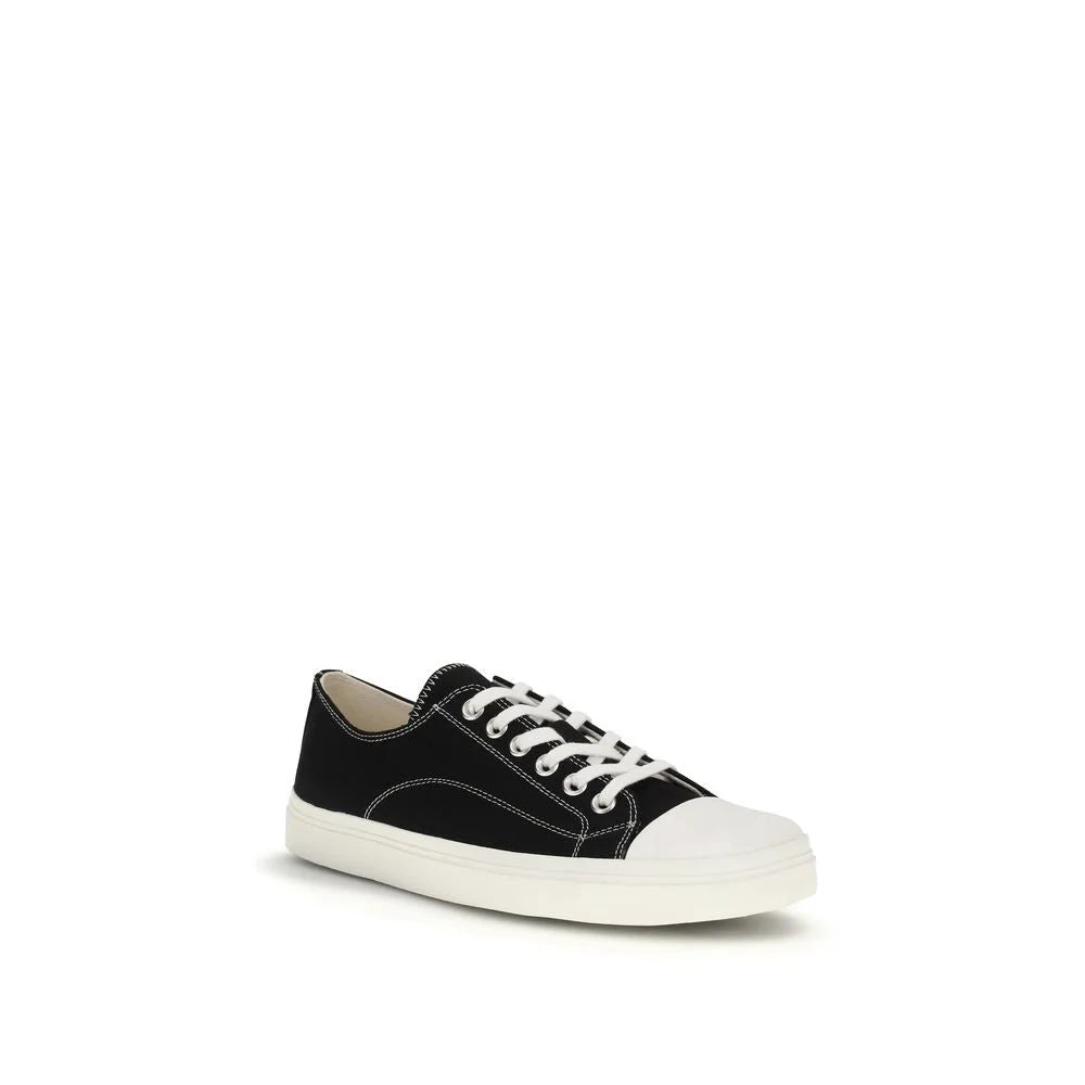 Side profile of Moschino low top sneakers in black cotton, showcasing the minimalist design and durable rubber sole.