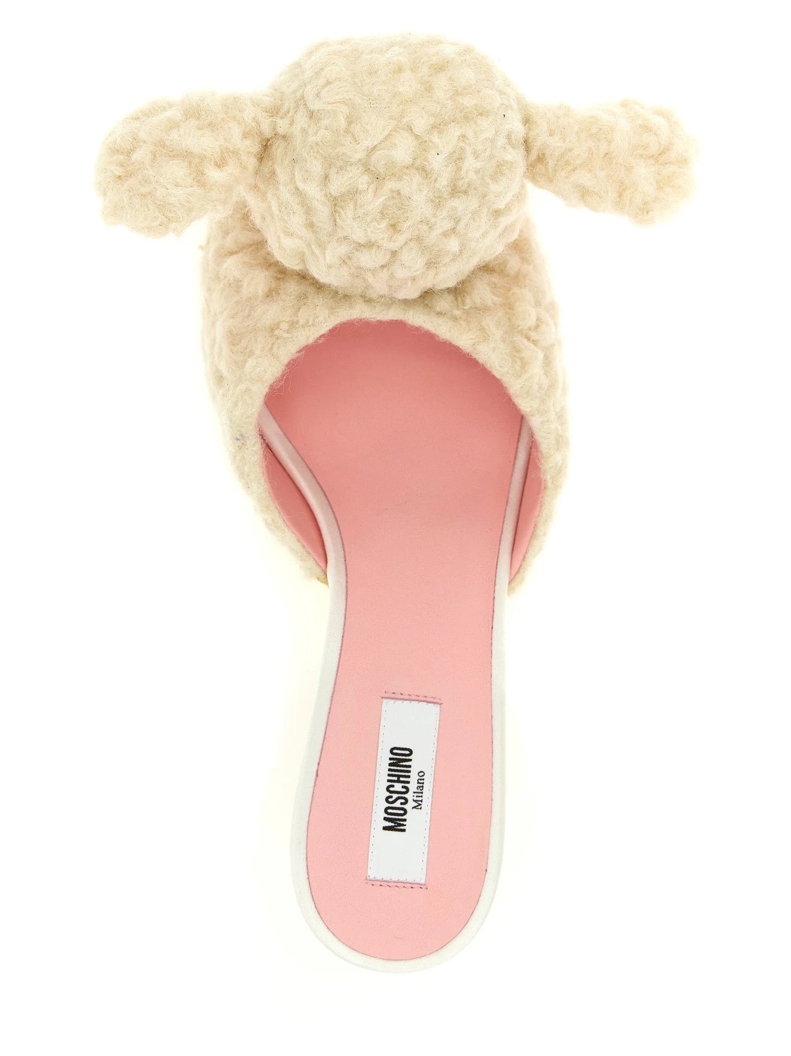 Close-up of the soft virgin wool texture and interior branding on Moschino white designer mules.
