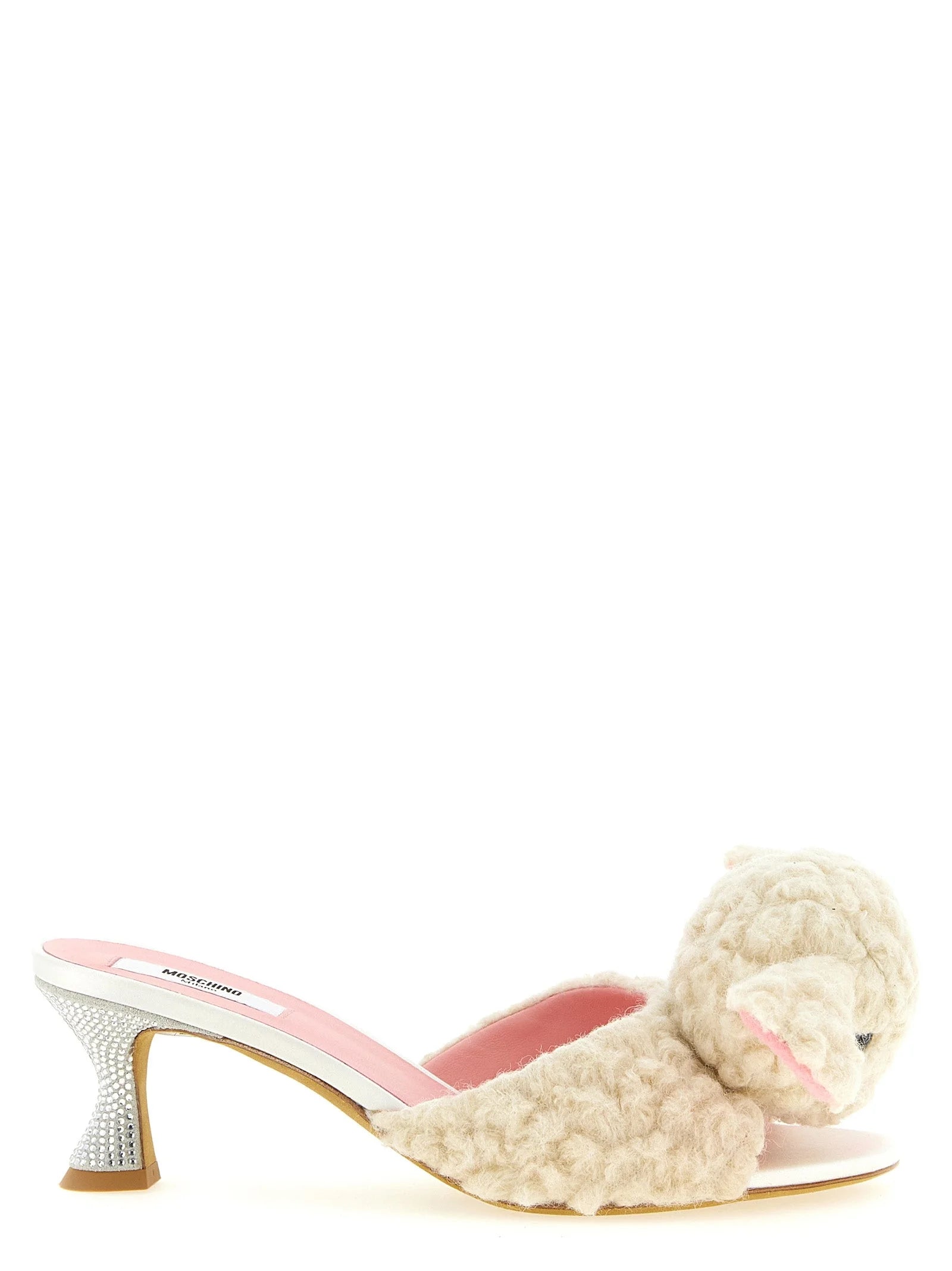 Moschino white virgin wool mules featuring a plush shearling-style texture and elegant pointed toe silhouette.
