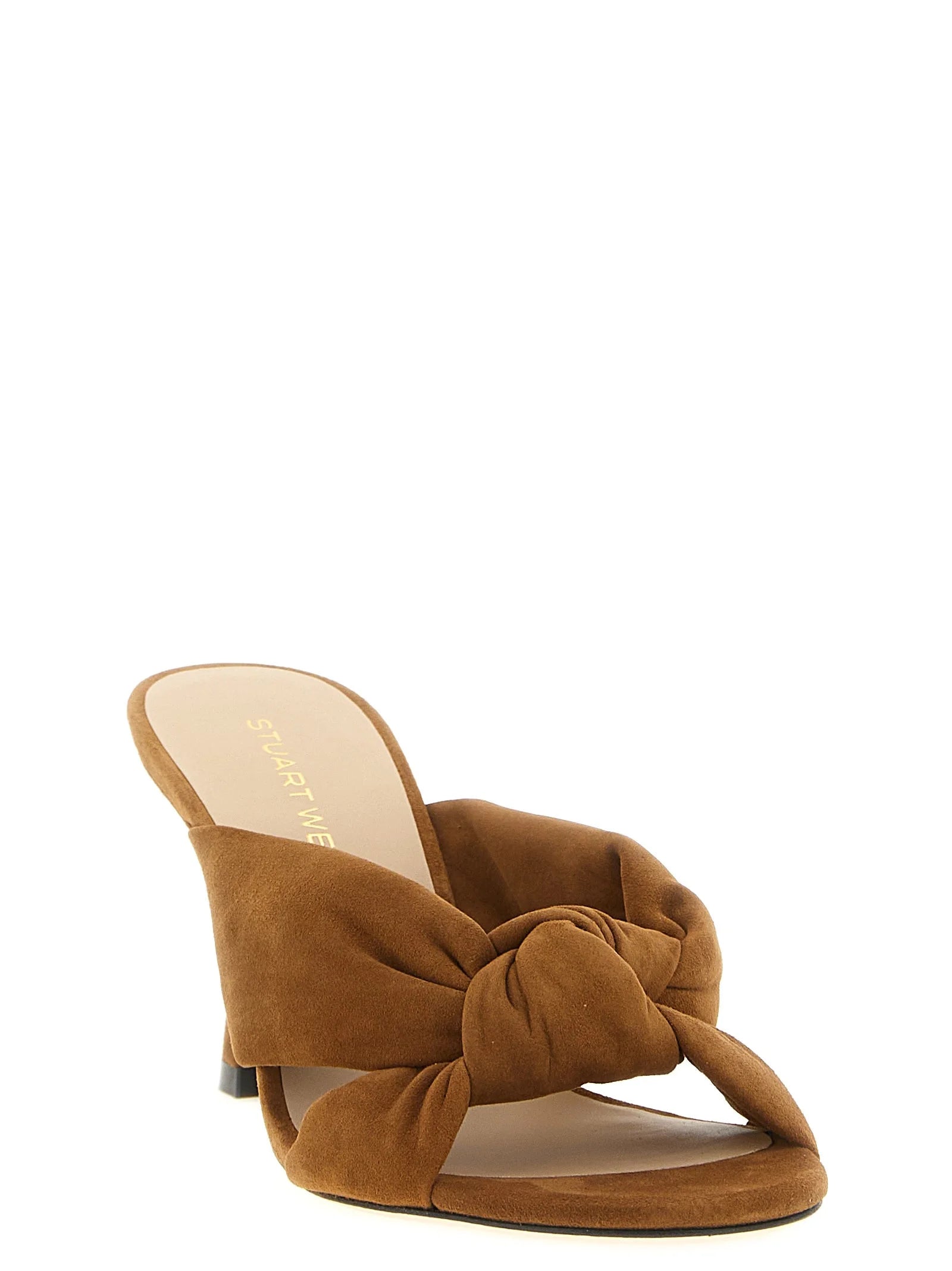 Side profile of Stuart Weitzman brown sandals showcasing the elegant high stiletto heel and refined ankle strap.