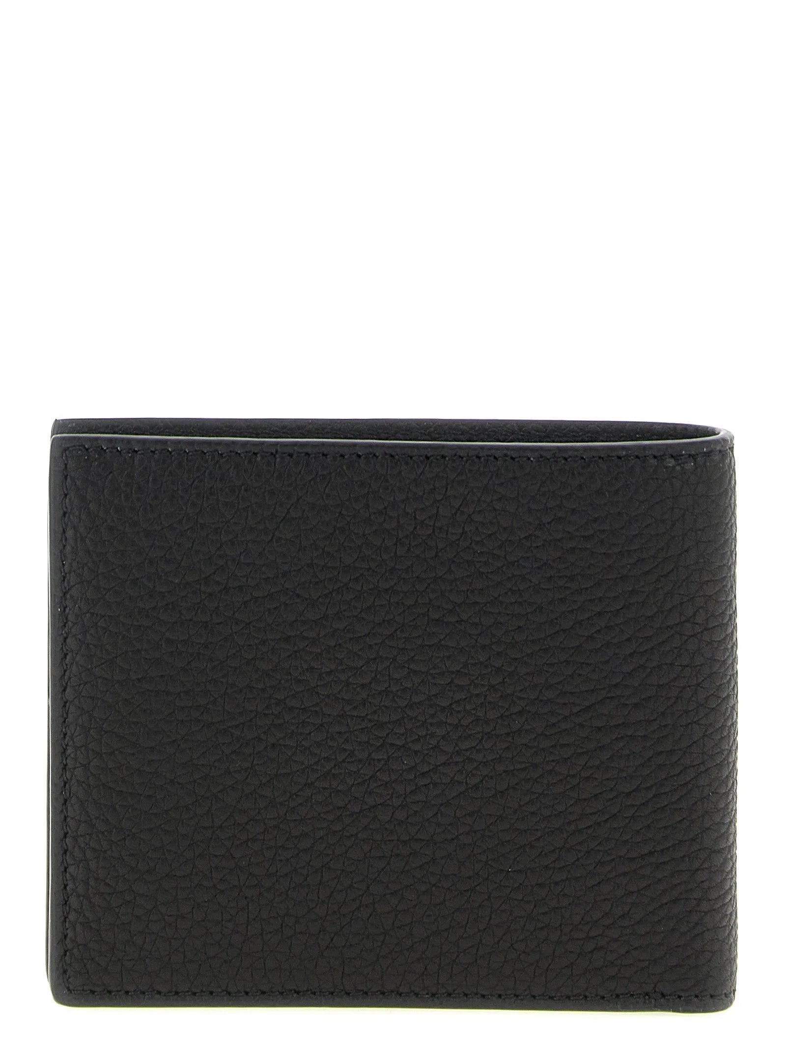 Interior view of the Tom Ford men's wallet in black leather showing multiple card slots and precise Italian craftsmanship.