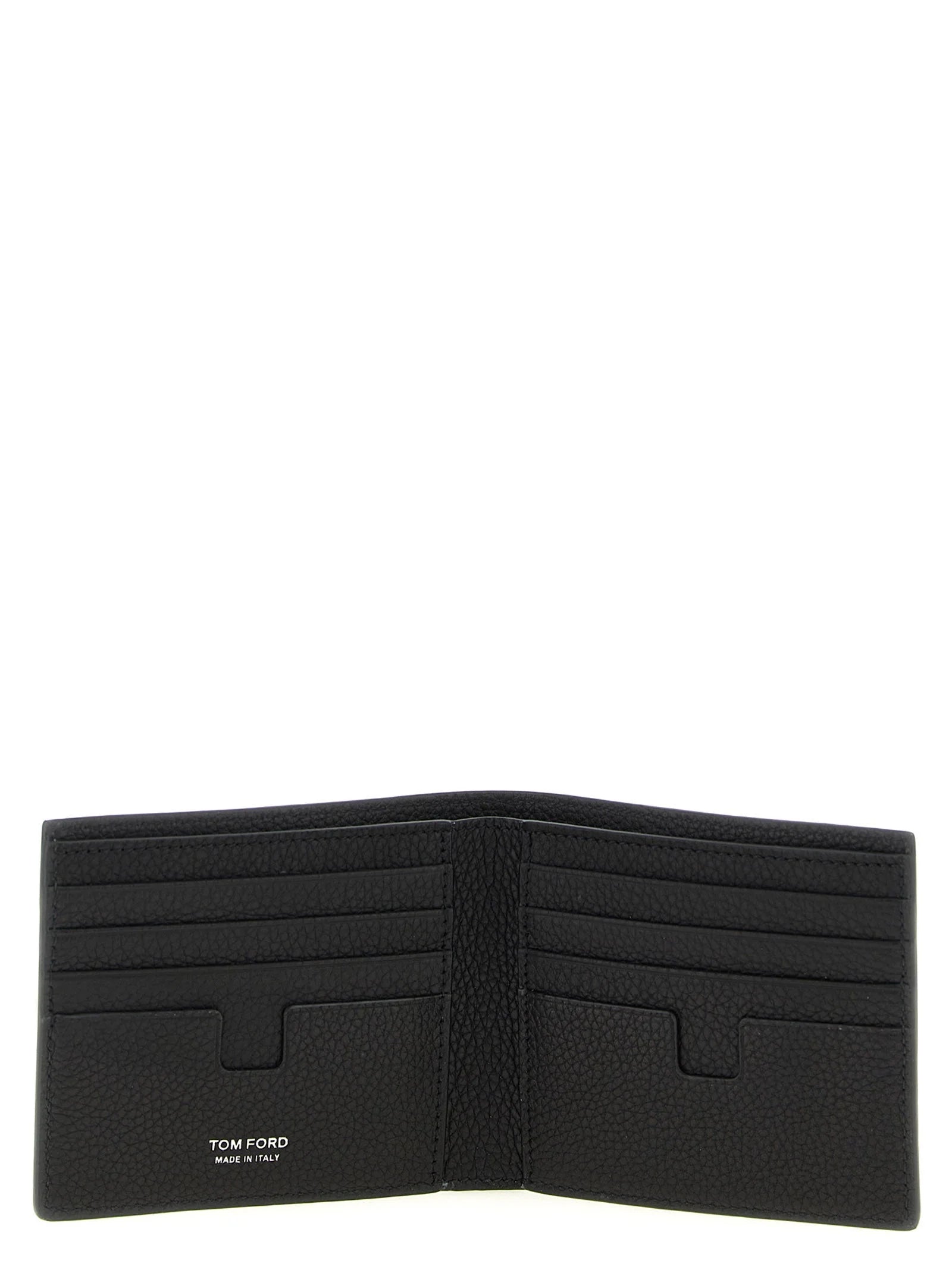 Close-up detail of the Tom Ford calfskin wallet highlighting the refined leather grain and gold foil embossed branding.