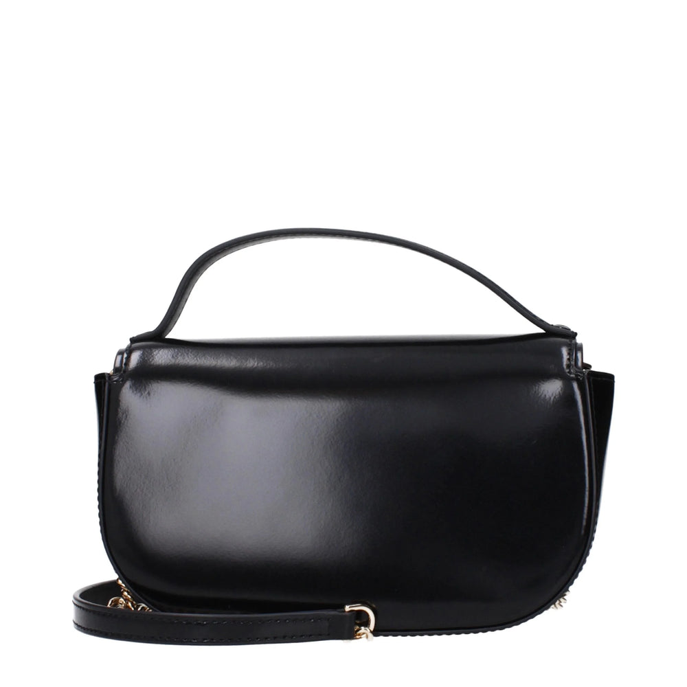 Rear view of the Tory Burch luxury leather handbag showing the smooth grain finish and clean, minimalist aesthetic.