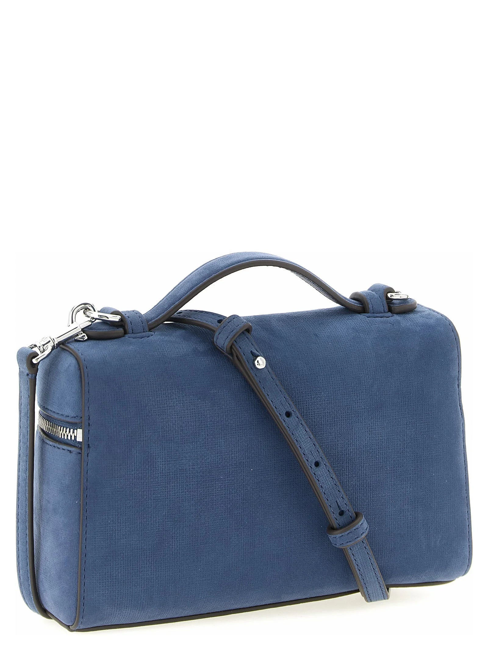 Sideprofil af Tory Burch blå skuldertaske i læder, der viser den slanke side og raffinerede syninger.