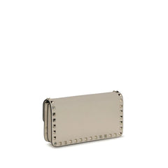 Rear view of the Valentino Garavani Bos Taurus wallet in smooth beige leather, highlighting the minimalist silhouette.