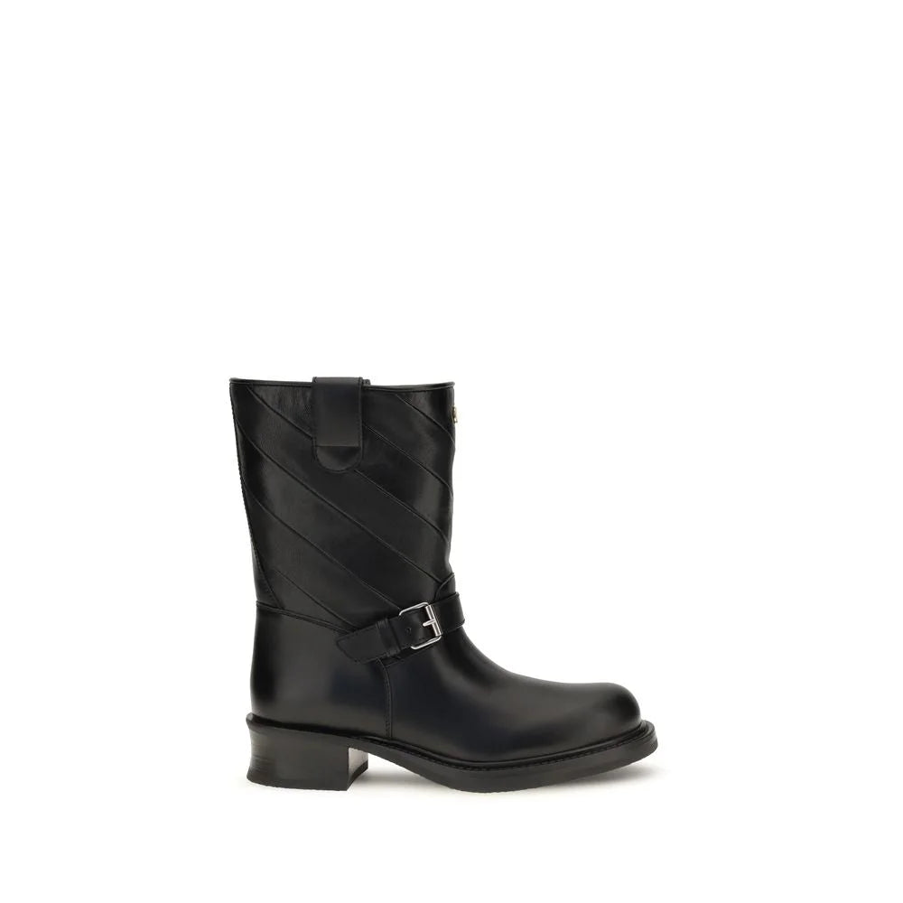 Valentino Garavani schwarze Ankelstiefel aus Kalbsleder Bos Taurus mit einer schlanken spitzer Spitze und einem skulptierten Blockabsatz.