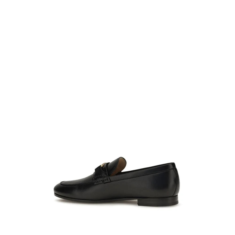 Vue arrière des mocassins Bos Taurus en cuir de veau noir, talon structuré et coutures ton sur ton.